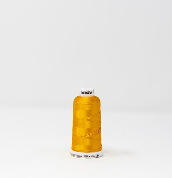 #911-1172 1,100 yard spool of #40 weight Egg Yolk Yellow Rayon machine embroidery thread.